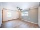 Serene bedroom with shiplap accent wall, wood-look flooring, and bright windows offering natural light at 333 Belleair Ne Dr, St Petersburg, FL 33704
