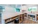 Spacious kitchen featuring marble countertops, herringbone backsplash, and open layout leading to the living areas at 333 Belleair Ne Dr, St Petersburg, FL 33704
