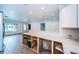 Open kitchen featuring marble countertops, herringbone backsplash, and recessed lighting throughout the main living area at 333 Belleair Ne Dr, St Petersburg, FL 33704