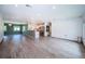 Open-concept living area with tile flooring, recessed lights, flowing into an adjacent dining area and kitchen at 333 Belleair Ne Dr, St Petersburg, FL 33704