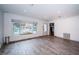Bright room with wood-look tile flooring, a large window, and modern recessed lighting at 333 Belleair Ne Dr, St Petersburg, FL 33704