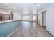 Open floor plan offering wood-look tile flooring, recessed lights, and a large window at 333 Belleair Ne Dr, St Petersburg, FL 33704