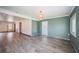Spacious living room featuring wood-look flooring, shiplap accents, and recessed lighting throughout the main living area at 333 Belleair Ne Dr, St Petersburg, FL 33704
