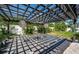 Backyard pergola with decorative lighting and tropical landscaping at 333 Belleair Ne Dr, St Petersburg, FL 33704