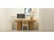 Functional home office space features a wooden desk, comfortable chair and great natural light at 36013 Joseph Blake St, Zephyrhills, FL 33541