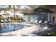 Community pool with lounge chairs, tables, and a cabana offers a resort-style experience at 36013 Joseph Blake St, Zephyrhills, FL 33541