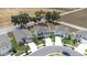 Aerial view of home with inviting front porch and convenient two car garage at 36398 Spanish Rose Dr, Dade City, FL 33525