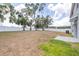 Large backyard featuring a white fence and grass at 36398 Spanish Rose Dr, Dade City, FL 33525