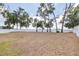 Spacious backyard with white fence, trees providing privacy at 36398 Spanish Rose Dr, Dade City, FL 33525