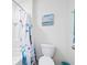Bathroom features a shower-tub combination and white toilet at 36398 Spanish Rose Dr, Dade City, FL 33525