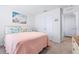 Inviting bedroom features coastal decor, light walls, and plush carpeting at 36398 Spanish Rose Dr, Dade City, FL 33525