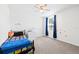 Bedroom features a black bed frame and neutral color scheme at 36398 Spanish Rose Dr, Dade City, FL 33525