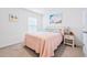 Cozy bedroom with a beach theme, featuring a plush bed and charming decor at 36398 Spanish Rose Dr, Dade City, FL 33525