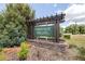 Community sign reads Heritage Hills with lush landscaping surrounding it at 36398 Spanish Rose Dr, Dade City, FL 33525