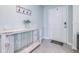 Welcoming entryway with a decorative table and hooks, creating a warm and organized first impression at 36398 Spanish Rose Dr, Dade City, FL 33525