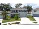 Two-story home with a covered porch and two car garage in Heritage Hills at 36398 Spanish Rose Dr, Dade City, FL 33525