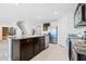 Spacious kitchen with a kitchen island, stainless steel appliances, and tile flooring at 36398 Spanish Rose Dr, Dade City, FL 33525