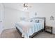 Charming bedroom with coastal decor, ceiling fan, and inviting bedding at 36398 Spanish Rose Dr, Dade City, FL 33525