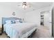 Inviting bedroom with coastal theme and cozy bedding, offering a serene retreat at 36398 Spanish Rose Dr, Dade City, FL 33525