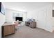 Bright home office features modern desks, neutral carpet, and a large window for ample natural light at 36398 Spanish Rose Dr, Dade City, FL 33525
