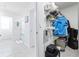 Open walk-in closet with organizing racks and shelves in a room with an en suite bathroom at 36398 Spanish Rose Dr, Dade City, FL 33525
