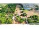 Scenic aerial view of a property with a pond, outlining the boundaries and showing the residence at 36601 Roberts Rd, Dade City, FL 33525