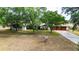 Aerial view of a charming residence with mature trees and a spacious lawn gives a sense of serenity at 36601 Roberts Rd, Dade City, FL 33525