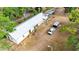 Aerial view of the property and the surrounding area showing the outbuilding, a truck, and a trailer at 36601 Roberts Rd, Dade City, FL 33525