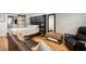 Comfortable bedroom with a plush bed, leather furniture, a sliding door, and stylish decor at 36601 Roberts Rd, Dade City, FL 33525