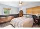 Charming bedroom features a ceiling fan, a window, and furnishings at 36601 Roberts Rd, Dade City, FL 33525