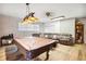 A game room features a billiards table and comfortable seating at 36601 Roberts Rd, Dade City, FL 33525