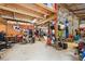 This large garage features a car lift, fan, and bikes, making it perfect for hobbyists and mechanics at 36601 Roberts Rd, Dade City, FL 33525