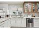 The kitchen features white cabinets, granite countertops, and stainless steel appliances at 36601 Roberts Rd, Dade City, FL 33525
