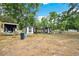 Exterior showcases a shed with unique features and ample outdoor space, ready for your hobby at 36601 Roberts Rd, Dade City, FL 33525