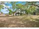 Expansive lot features lush mature trees offering shade and privacy for the home at 36601 Roberts Rd, Dade City, FL 33525