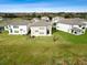 Aerial view of new construction homes with expansive lawns, showcasing the community's spacious lots and modern design at 38190 Shale Stone Ct, Zephyrhills, FL 33540