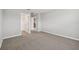 Bedroom with neutral carpet featuring an open doorway to other rooms at 38190 Shale Stone Ct, Zephyrhills, FL 33540