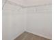 Walk-in closet featuring white walls, wire shelving, and soft carpet at 38190 Shale Stone Ct, Zephyrhills, FL 33540