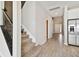 Inviting entryway with staircase and open access to the kitchen at 38190 Shale Stone Ct, Zephyrhills, FL 33540
