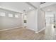 Inviting living space with wood-look tile, neutral walls, and a glimpse of the staircase at 38190 Shale Stone Ct, Zephyrhills, FL 33540