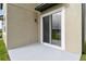 Exterior patio offers a tranquil outdoor space with modern features and ample light at 38190 Shale Stone Ct, Zephyrhills, FL 33540