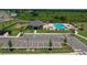 Community pool area featuring a pool, playground, clubhouse and ample parking; perfect for recreation and relaxation at 38190 Shale Stone Ct, Zephyrhills, FL 33540