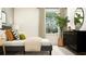 This airy bedroom offers a full-sized bed, a large indoor plant, and a black dresser at 4033 Northern Key Dr, Plant City, FL 33563