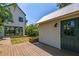 Stunning home featuring a beautiful wood deck with a charming outbuilding and lush tropical landscaping at 411 W Frances Ave # 2, Tampa, FL 33602