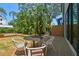 Backyard featuring a deck with outdoor seating and cottage view at 411 W Frances Ave # 2, Tampa, FL 33602
