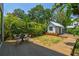 Inviting backyard featuring a deck, table, chairs, and a cottage at 411 W Frances Ave # 2, Tampa, FL 33602