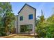This two-story home features a lovely backyard with a wood deck and sliding glass doors for indoor/outdoor living at 411 W Frances Ave # 2, Tampa, FL 33602