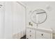 Bathroom featuring a vanity with drawers, a round mirror, and a shower with a curtain at 411 W Frances Ave # 2, Tampa, FL 33602