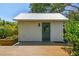 Backyard cottage featuring modern design and a small deck at 411 W Frances Ave # 2, Tampa, FL 33602