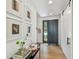 Stylish foyer with hardwood floors, modern decor, and a black sliding door, offering a chic and functional entrance at 411 W Frances Ave # 2, Tampa, FL 33602